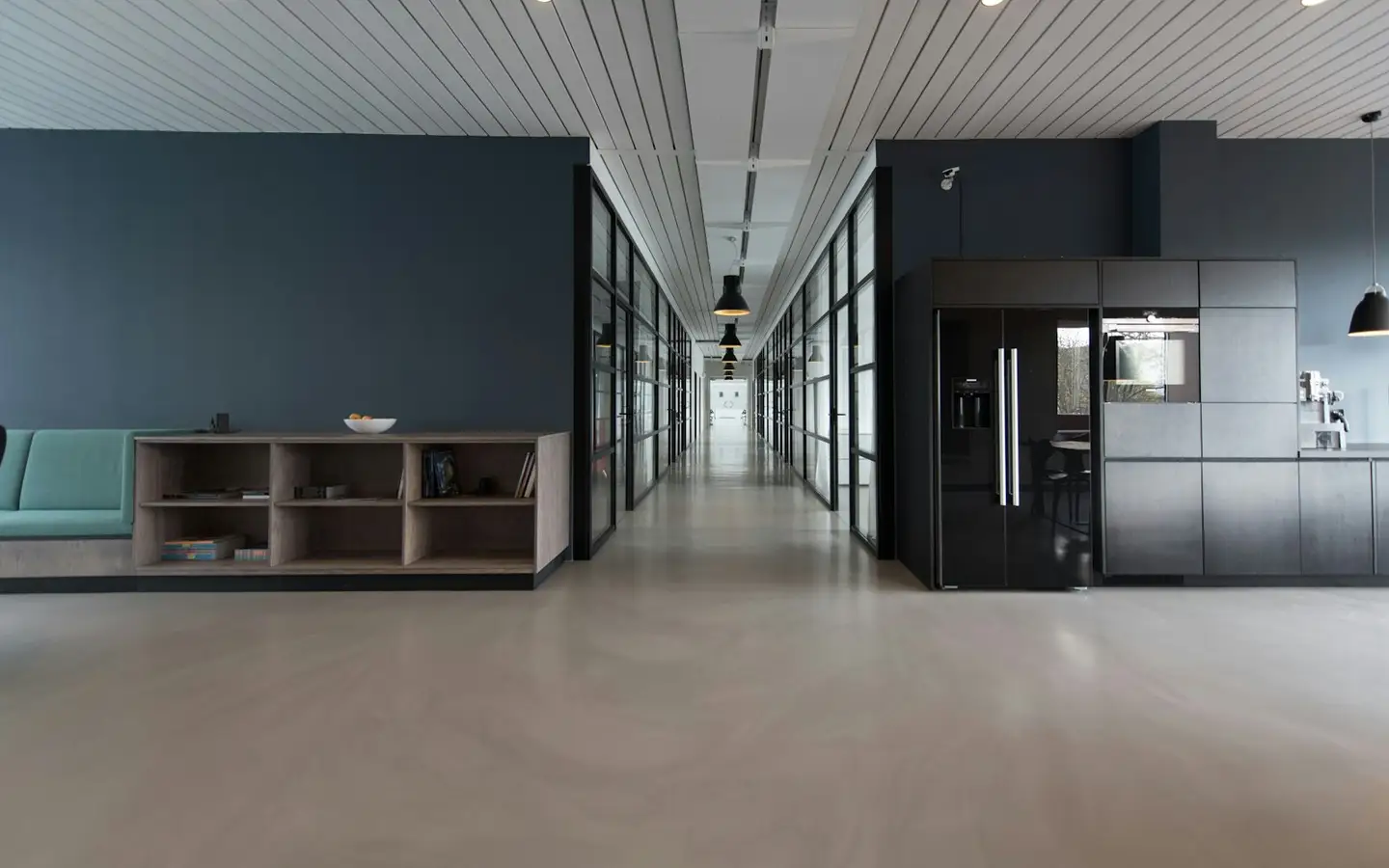 Dark minimalist executive architectural interior with subtle glass reflections